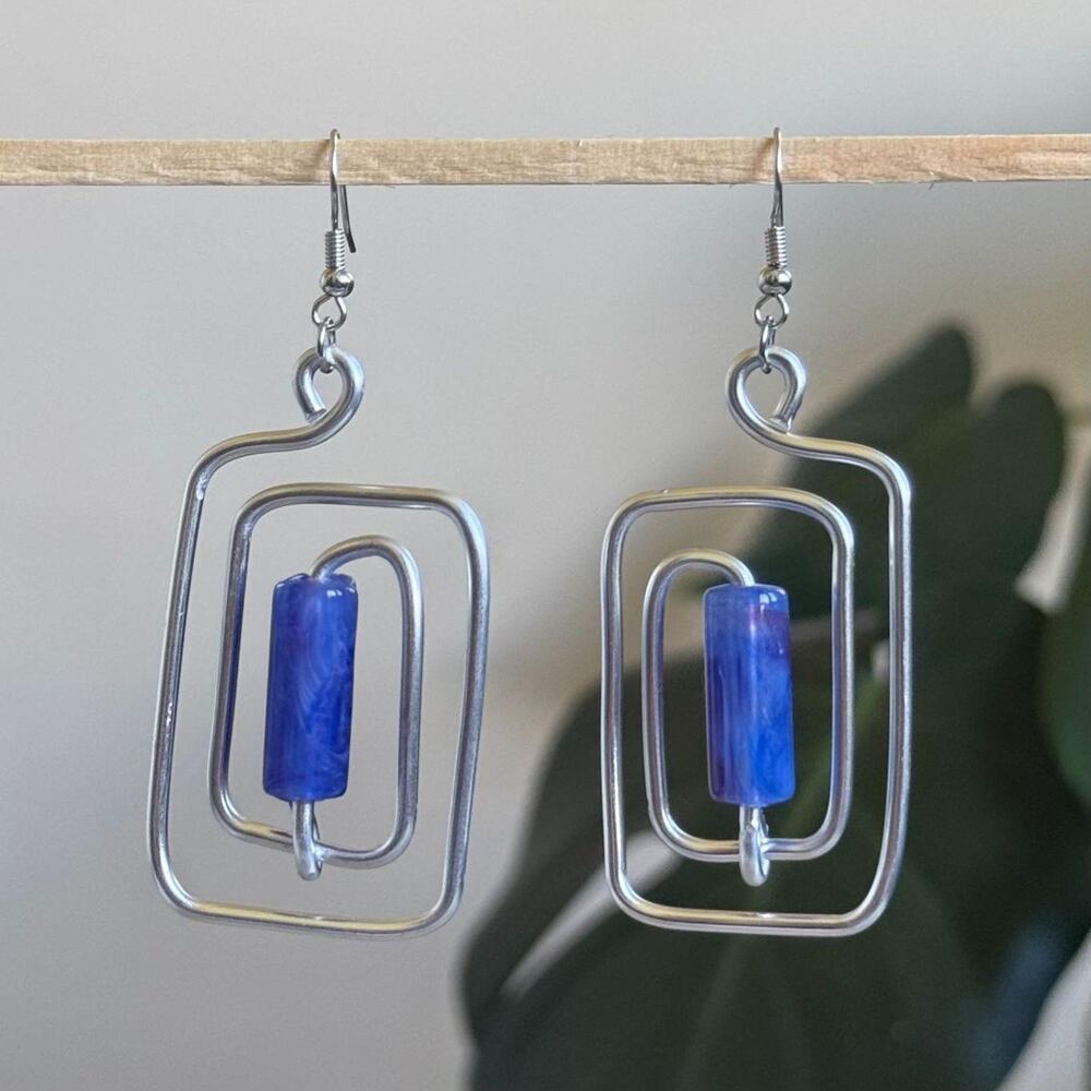 handmade silver wire spiral earrings with royal blue colored tube beads